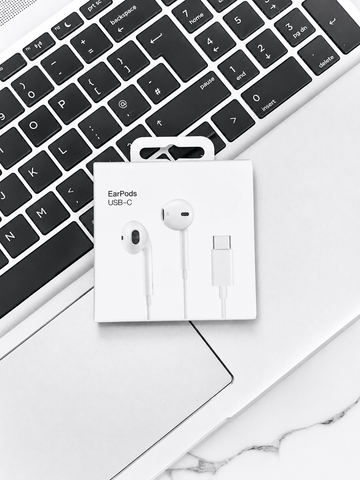 Apple EarPods USB-C earphones on laptop